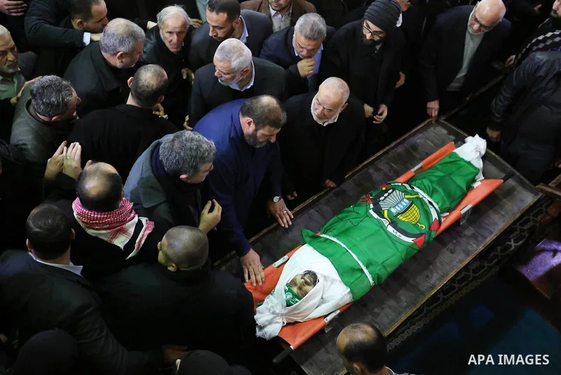Palestinians mourn over the body of Hamas senior leader Imad al-Alami during his funeral at the al-Omari mosque in Gaza City on January 30, 2018. A senior Hamas official has died in Gaza three weeks after shooting himsel...