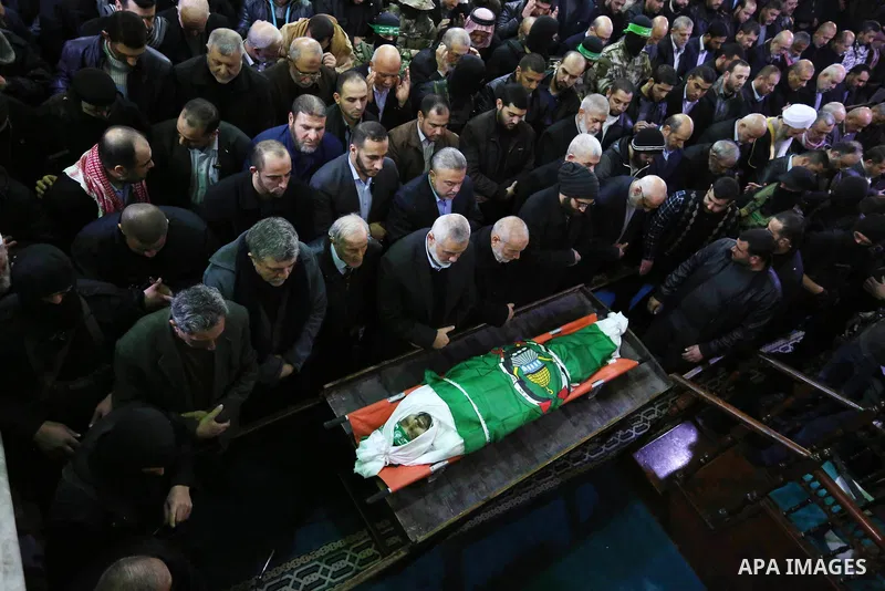 Palestinian mourners pray over the body of Hamas senior leader Imad al-Alami during his funeral at the al-Omari mosque in Gaza City on January 30, 2018. A senior Hamas official has died in Gaza three weeks after shooting...