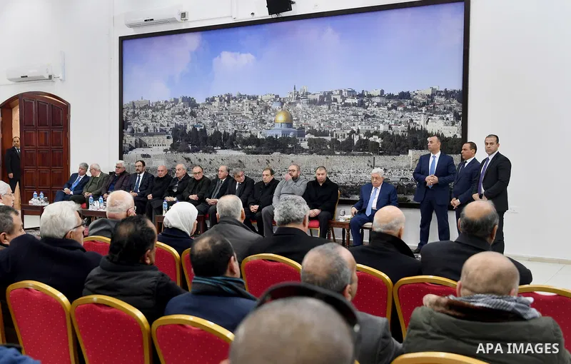 Palestinian President Mahmoud Abbas receives condolences of Ghassan Shakaa, a member of the Executive Committee of the PLO at his headquarters in the West Bank city of Ramallah on January 30, 2018. Photo by Osama Falah