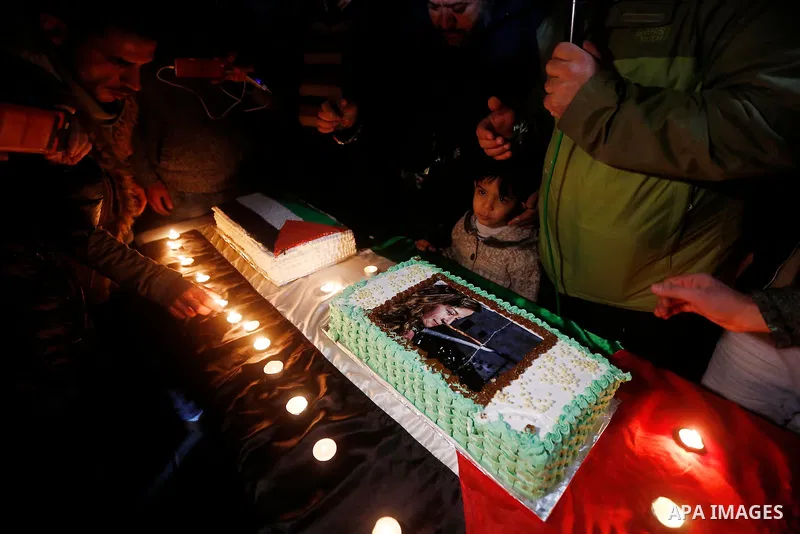 Palestinians take part in a symbolic birthday party for Palestinian teen Ahed Tamimi, who is detained by Israel, in the West Bank city of Hebron January 30, 2018. Photo by Wisam Hashlamoun