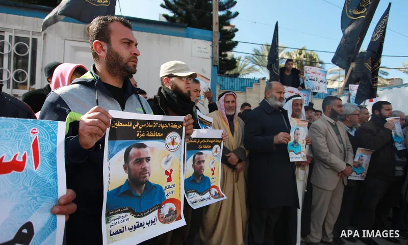 Palestinians take part in a protest to show solidarity with Ayoub el-Assa, who is hunger strike in Israeli jails, in front of the high commissioner for human rights headquarters, in Gaza city on January 31, 2018. Photo b...