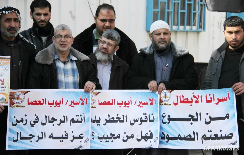 Palestinians take part in a protest to show solidarity with Ayoub el-Assa, who is hunger strike in Israeli jails, in front of the high commissioner for human rights headquarters, in Gaza city on January 31, 2018. Photo b...