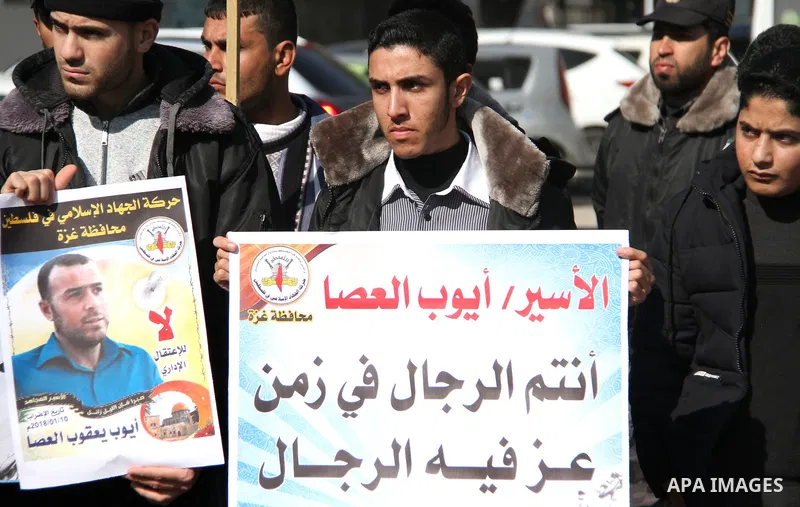 Palestinians take part in a protest to show solidarity with Ayoub el-Assa, who is hunger strike in Israeli jails, in front of the high commissioner for human rights headquarters, in Gaza city on January 31, 2018. Photo b...