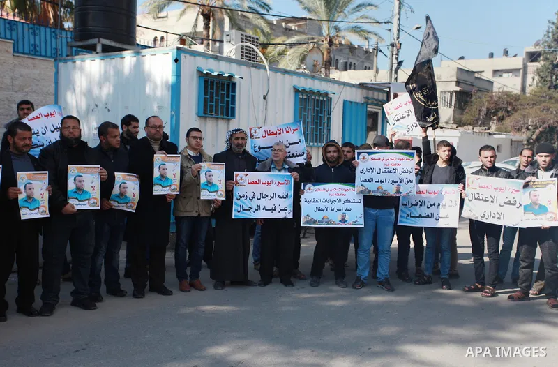 Palestinians take part in a protest to show solidarity with Ayoub el-Assa, who is hunger strike in Israeli jails, in front of the high commissioner for human rights headquarters, in Gaza city on January 31, 2018. Photo b...