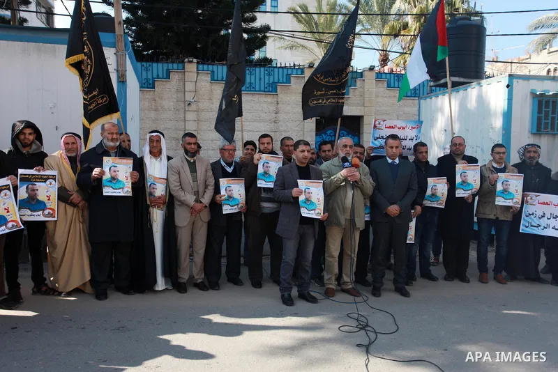 Palestinians take part in a protest to show solidarity with Ayoub el-Assa, who is hunger strike in Israeli jails, in front of the high commissioner for human rights headquarters, in Gaza city on January 31, 2018. Photo b...