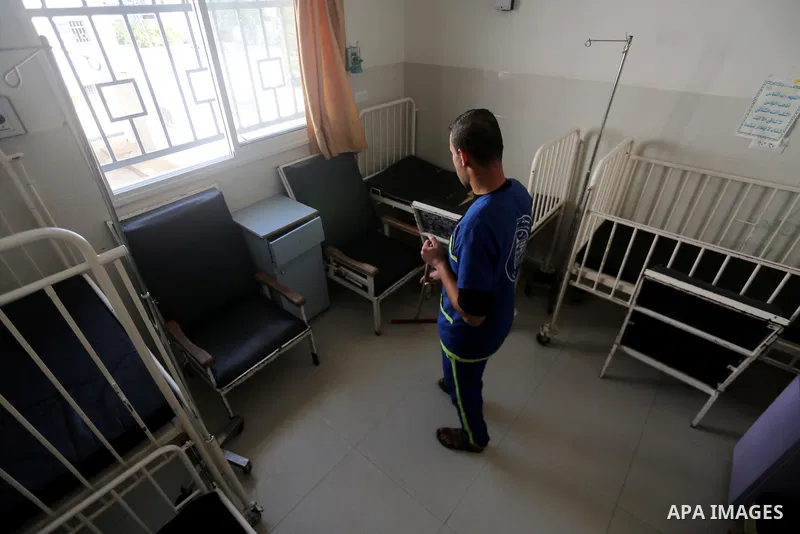 An employee of the Palestinian health ministry checks the Mohammed al-Dorra pediatric hospital in Gaza city on January 31, 2018 after it ran out of fuel. For months Gaza’s health ministry has been warning that it will be...