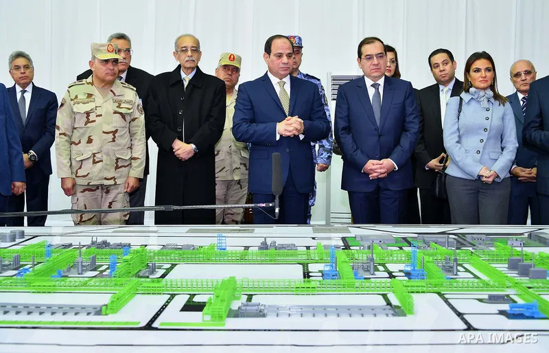 Egyptian President Abdel Fattah al-Sisi looks at mockups of natural gas extraction facilities during the inauguruation of the offshore Zohr gas field in the northern Suez canal city of Port Said, on January 31, 2018. At...