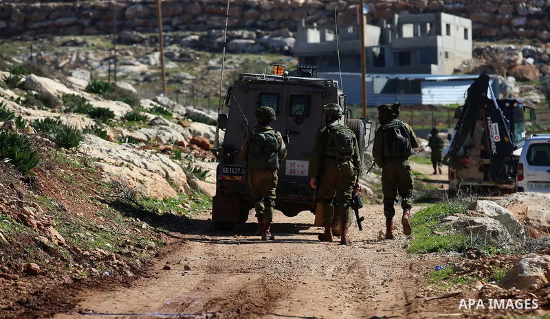 Israeli security forces stand guard as bulldozer demolish house which Israeli authorities said it was built without a permit during attempt to demolish it, at village of Beit Dajan, east of the West Bank city of Nablus o...