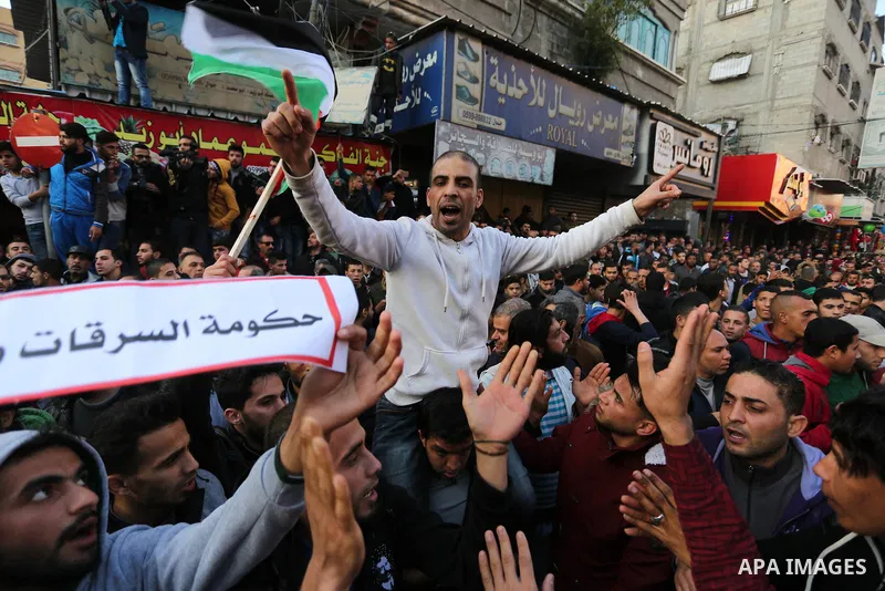 Palestinians participate in a demonstration to support the palestinian reconciliation efforts between Fatah and Hamas, and demand better living conditions, in Jabalia in the northern Gaza Strip on February 01, 2018. Phot...