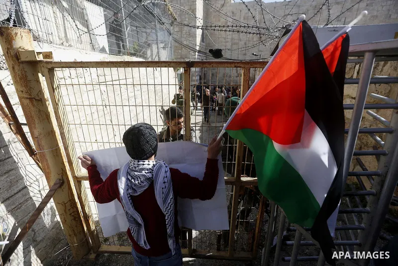 Palestinian protesters take part in a demonstration to mark the 24th anniversary of Ibrahimi mosque massacre when Baruch Goldstein an Israeli settler opened fire and killing 29 Palestinian worshipers On February 25, 1994...