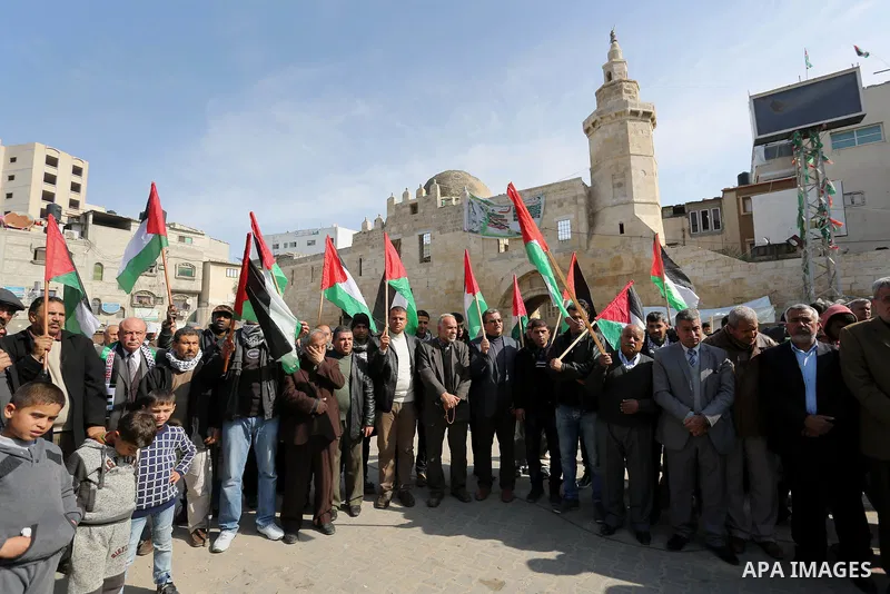 Palestinians take part in a protest against US President Donald Trump's decision to recognise Jerusalem as the capital of Israel in Khan Younis in the southern Gaza strip on February 2, 2018. Photo by Ashraf Amra
