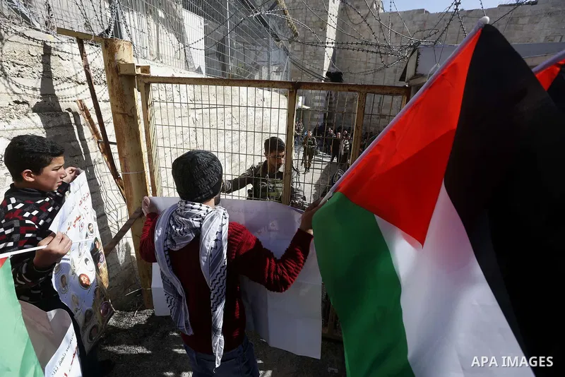 Palestinian protesters take part in a demonstration to mark the 24th anniversary of Ibrahimi mosque massacre when Baruch Goldstein an Israeli settler opened fire and killing 29 Palestinian worshipers On February 25, 1994...