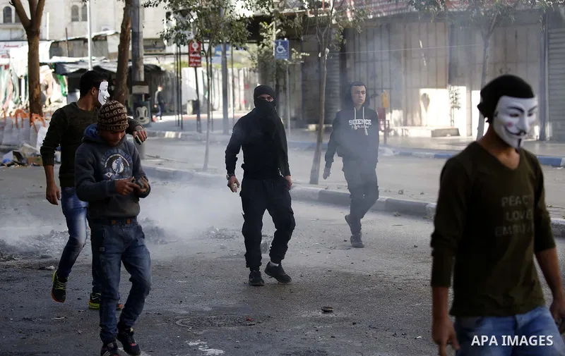 Palestinian protesters clash with Israeli security forces in the West Bank city of Hebron on February 2, 2018 2018 as demonstrations continue over the US president's controversial recognition of Jerusalem as Israel's cap...