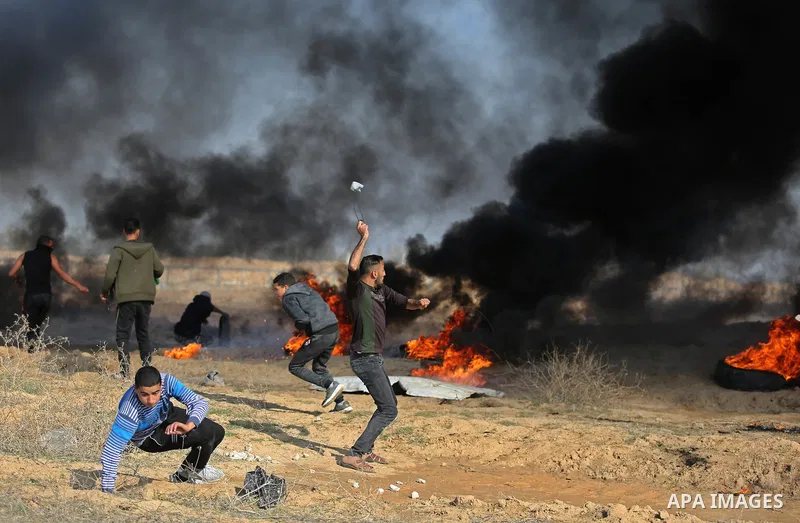 Palestinian protesters clash with Israeli security forces, against US President Donald Trump's decision to recognise Jerusalem as the capital of Israel, near the border with Israel in the southern Gaza Strip on February...