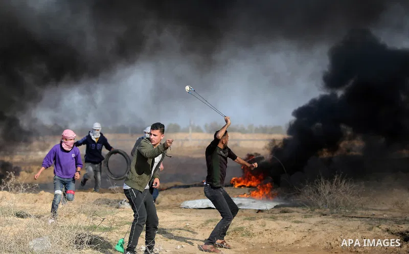 Palestinian protesters clash with Israeli security forces, against US President Donald Trump's decision to recognise Jerusalem as the capital of Israel, near the border with Israel in the southern Gaza Strip on February...