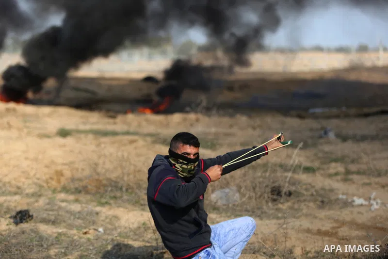 Palestinian protesters clash with Israeli security forces, against US President Donald Trump's decision to recognise Jerusalem as the capital of Israel, near the border with Israel in the southern Gaza Strip on February...