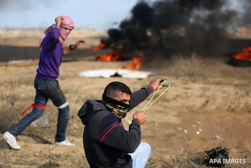 Palestinian protesters clash with Israeli security forces, against US President Donald Trump's decision to recognise Jerusalem as the capital of Israel, near the border with Israel in the southern Gaza Strip on February...