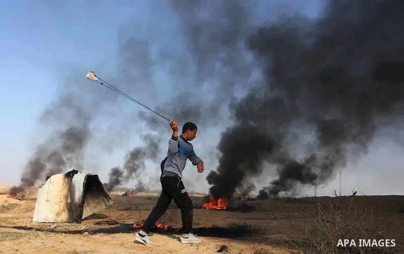 Palestinian protesters clash with Israeli security forces, against US President Donald Trump's decision to recognise Jerusalem as the capital of Israel, near the border with Israel in the southern Gaza Strip on February...
