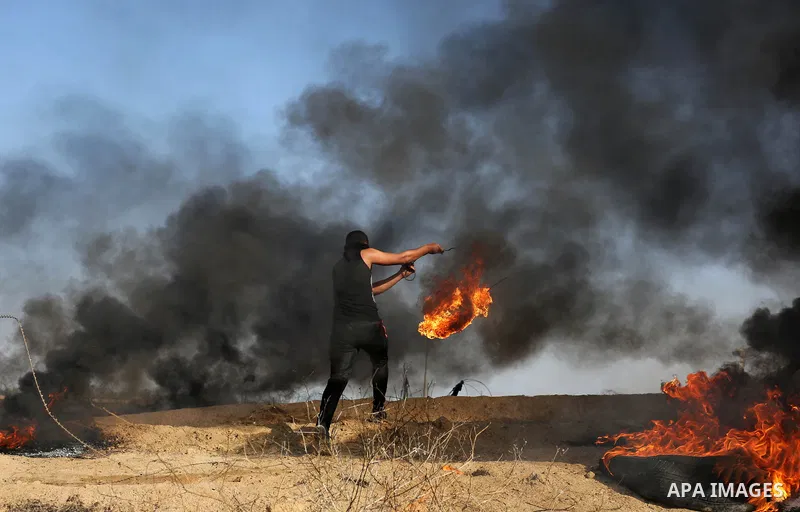 Palestinian protesters clash with Israeli security forces, against US President Donald Trump's decision to recognise Jerusalem as the capital of Israel, near the border with Israel in the southern Gaza Strip on February...