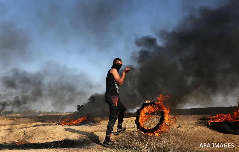Palestinian protesters clash with Israeli security forces, against US President Donald Trump's decision to recognise Jerusalem as the capital of Israel, near the border with Israel in the southern Gaza Strip on February...