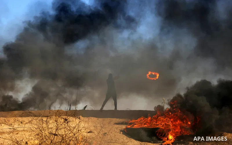 Palestinian protesters clash with Israeli security forces, against US President Donald Trump's decision to recognise Jerusalem as the capital of Israel, near the border with Israel in the southern Gaza Strip on February...