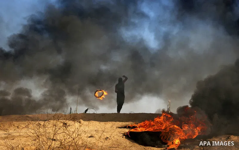 Palestinian protesters clash with Israeli security forces, against US President Donald Trump's decision to recognise Jerusalem as the capital of Israel, near the border with Israel in the southern Gaza Strip on February...