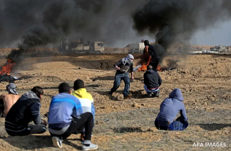 Palestinian protesters clash with Israeli security forces, against US President Donald Trump's decision to recognise Jerusalem as the capital of Israel, near the border with Israel in the southern Gaza Strip on February...