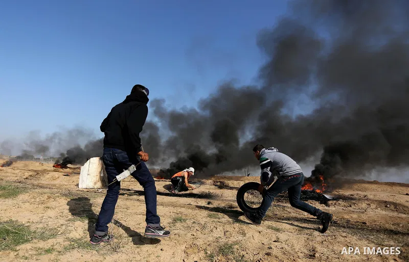 Palestinian protesters clash with Israeli security forces, against US President Donald Trump's decision to recognise Jerusalem as the capital of Israel, near the border with Israel in the southern Gaza Strip on February...