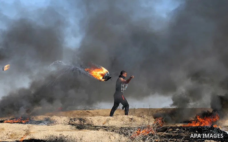 Palestinian protesters clash with Israeli security forces, against US President Donald Trump's decision to recognise Jerusalem as the capital of Israel, near the border with Israel in the southern Gaza Strip on February...