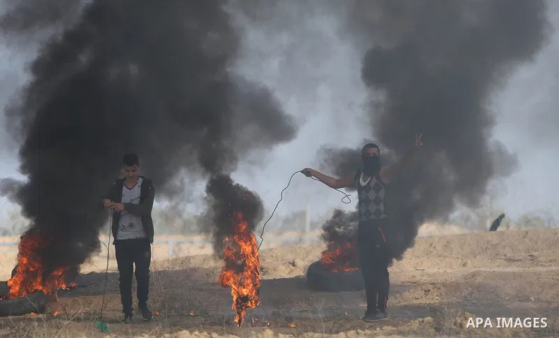 Palestinian protesters clash with Israeli security forces, against US President Donald Trump's decision to recognise Jerusalem as the capital of Israel, near the border with Israel in the southern Gaza Strip on February...