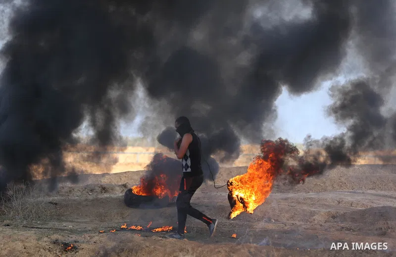 Palestinian protesters clash with Israeli security forces, against US President Donald Trump's decision to recognise Jerusalem as the capital of Israel, near the border with Israel in the southern Gaza Strip on February...