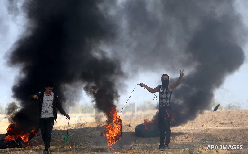 Palestinian protesters clash with Israeli security forces, against US President Donald Trump's decision to recognise Jerusalem as the capital of Israel, near the border with Israel in the southern Gaza Strip on February...