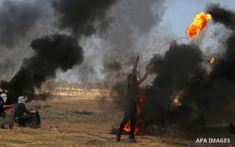 Palestinian protesters clash with Israeli security forces, against US President Donald Trump's decision to recognise Jerusalem as the capital of Israel, near the border with Israel in the southern Gaza Strip on February...