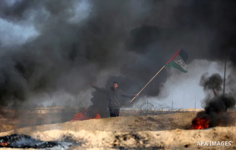 Palestinian protesters clash with Israeli security forces, against US President Donald Trump's decision to recognise Jerusalem as the capital of Israel, near the border with Israel in the southern Gaza Strip on February...