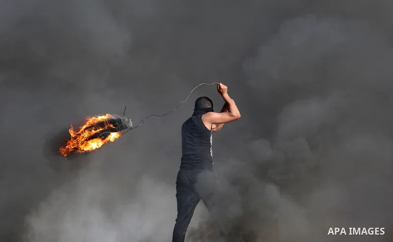 Palestinian protesters clash with Israeli security forces, against US President Donald Trump's decision to recognise Jerusalem as the capital of Israel, near the border with Israel in the southern Gaza Strip on February...