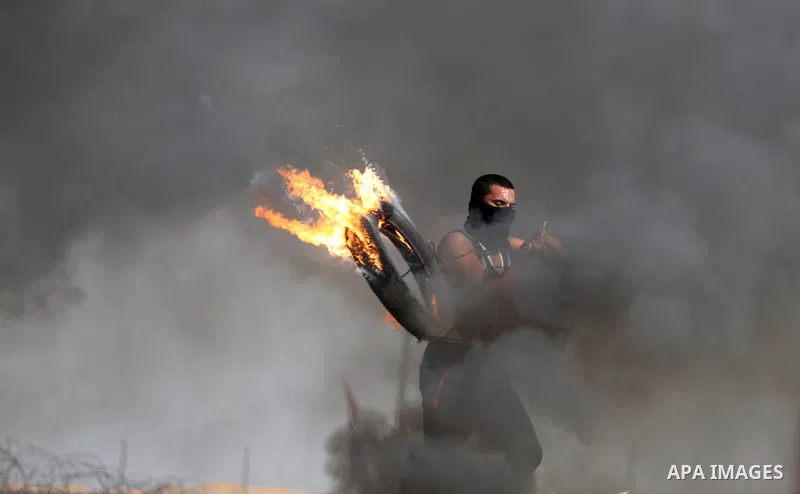 Palestinian protesters clash with Israeli security forces, against US President Donald Trump's decision to recognise Jerusalem as the capital of Israel, near the border with Israel in the southern Gaza Strip on February...