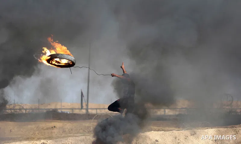Palestinian protesters clash with Israeli security forces, against US President Donald Trump's decision to recognise Jerusalem as the capital of Israel, near the border with Israel in the southern Gaza Strip on February...