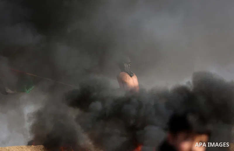 Palestinian protesters clash with Israeli security forces, against US President Donald Trump's decision to recognise Jerusalem as the capital of Israel, near the border with Israel in the southern Gaza Strip on February...
