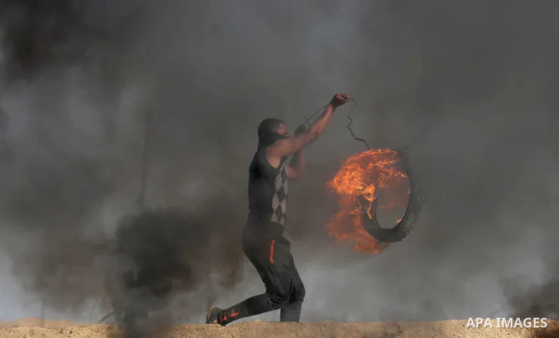 Palestinian protesters clash with Israeli security forces, against US President Donald Trump's decision to recognise Jerusalem as the capital of Israel, near the border with Israel in the southern Gaza Strip on February...