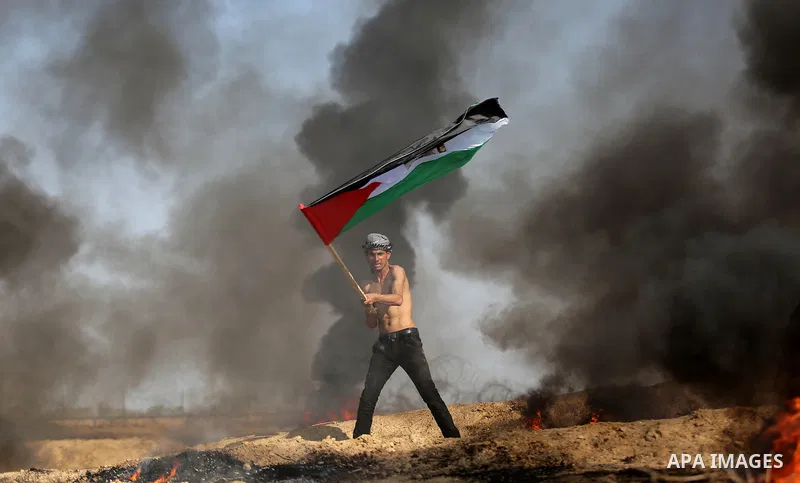 Palestinian protesters clash with Israeli security forces, against US President Donald Trump's decision to recognise Jerusalem as the capital of Israel, near the border with Israel in the southern Gaza Strip on February...