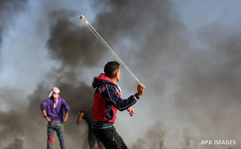 Palestinian protesters clash with Israeli security forces, against US President Donald Trump's decision to recognise Jerusalem as the capital of Israel, near the border with Israel in the southern Gaza Strip on February...