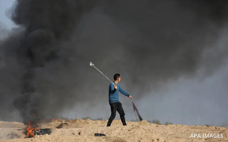Palestinian protesters clash with Israeli security forces, against US President Donald Trump's decision to recognise Jerusalem as the capital of Israel, near the border with Israel in the southern Gaza Strip on February...