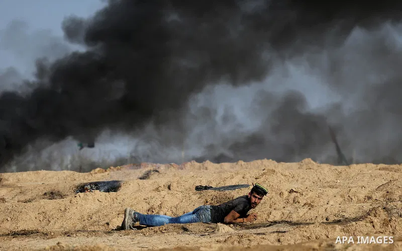 Palestinian protesters clash with Israeli security forces, against US President Donald Trump's decision to recognise Jerusalem as the capital of Israel, near the border with Israel in the southern Gaza Strip on February...