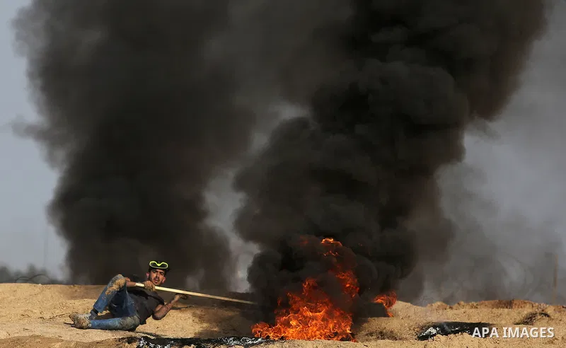 Palestinian protesters clash with Israeli security forces, against US President Donald Trump's decision to recognise Jerusalem as the capital of Israel, near the border with Israel in the southern Gaza Strip on February...