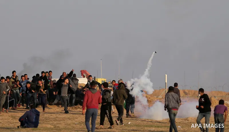 Palestinian protesters clash with Israeli security forces, against US President Donald Trump's decision to recognise Jerusalem as the capital of Israel, near the border with Israel in the southern Gaza Strip on February...