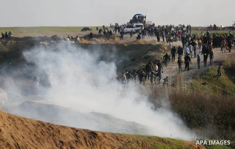 Palestinian protesters clash with Israeli security forces, against US President Donald Trump's decision to recognise Jerusalem as the capital of Israel, near the border with Israel in the southern Gaza Strip on February...