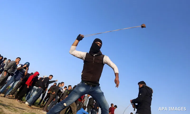 Palestinian protesters clash with Israeli security forces, against US President Donald Trump's decision to recognise Jerusalem as the capital of Israel, near the border with Israel, east of Gaza City on February 2, 2018....