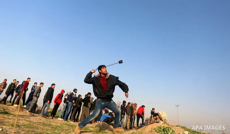 Palestinian protesters clash with Israeli security forces, against US President Donald Trump's decision to recognise Jerusalem as the capital of Israel, near the border with Israel, east of Gaza City on February 2, 2018....