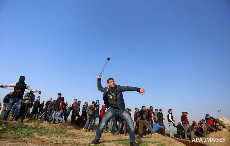 Palestinian protesters clash with Israeli security forces, against US President Donald Trump's decision to recognise Jerusalem as the capital of Israel, near the border with Israel, east of Gaza City on February 2, 2018....