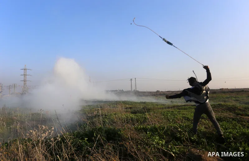Palestinian protesters clash with Israeli security forces, against US President Donald Trump's decision to recognise Jerusalem as the capital of Israel, near the border with Israel, east of Gaza City on February 2, 2018....